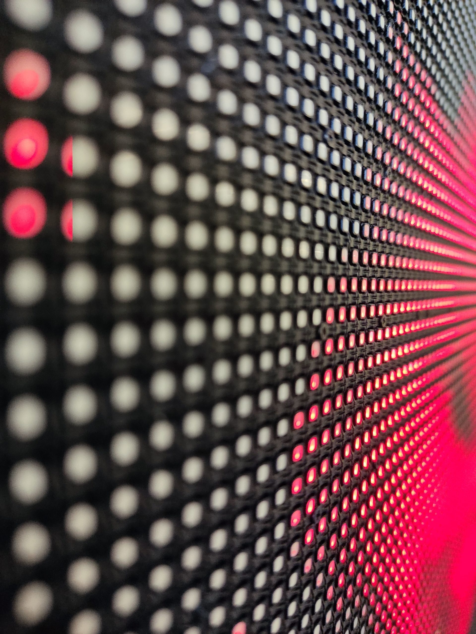 A Background of colorful luminous circles with pattern, closeup of a led screen